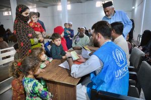 An Afghan refugee family being de-registered by UNHCR staff at the Voluntary Repatriation Centre before leaving their homeland Afghanistan
