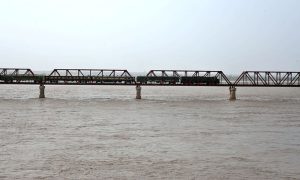 A view of Low-level Flood waters passing through at Indus River Kotri Barrage Jamshoro.