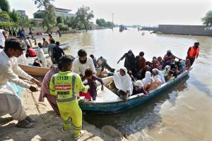 Residents being evacuated by rescue teams and boats to safer areas as rising waters from rivers submerge parts of South Punjab