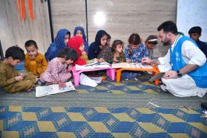 An Afghan refugee family being de-registered by UNHCR staff at the Voluntary Repatriation Centre before leaving their homeland Afghanistan