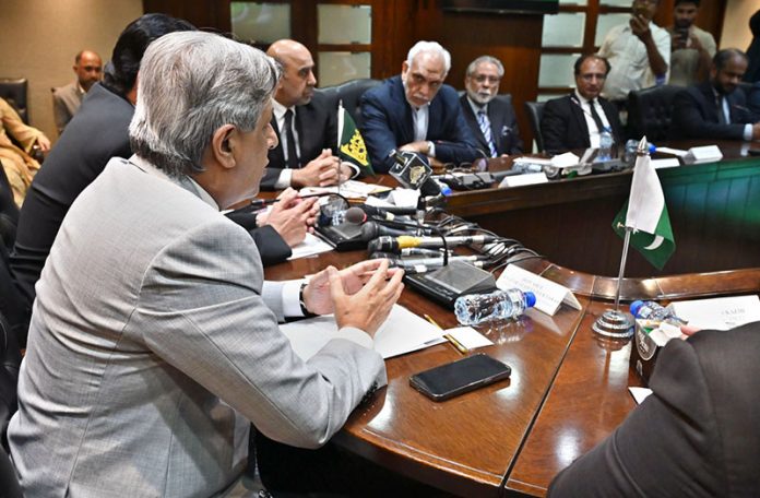 Federal Minister for Law and Justice, Senator Azam Nazeer Tarar, addressing the Memorandum of Cooperation signing ceremony between the International Mediation and Arbitration Center and the Federation of Pakistan Chambers of Commerce & Industry (FPCCI)