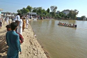Residents being evacuated by rescue teams and boats to safer areas as rising waters from rivers submerge parts of South Punjab