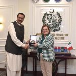 Muhammad Raza Hayat Harraj, Federal Minister for Defence Production is presenting a souvenir to H.E Ms. Marilina Armellin, Ambassador of Italy