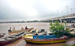 A view of rising floodwaters in the Ravi River passing under the bridge, as local authorities issue alerts urging residents to adopt safety measures.
