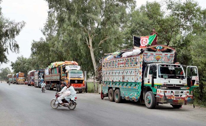 A view of loaded trucks with belongings of Afghan refugees outside the UNHCR Voluntary Repatriation Center, waiting to transport families to their homeland of Afghanistan after four decades