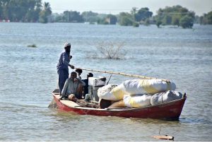 Residents being evacuated by rescue teams and boats to safer areas as rising waters from rivers submerge parts of South Punjab