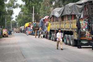 A view of loaded trucks with belongings of Afghan refugees outside the UNHCR Voluntary Repatriation Center, waiting to transport families to their homeland of Afghanistan after four decades