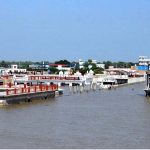 Floodwaters submerge houses and farmlands, displacing communities and inundating residential areas
