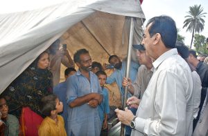 Chairman Senate Yusuf Raza Gilani addressing to media persons after reviewing facilities during his visit to a flood relief camp.