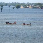 Rescue 1122 Boats carrying residents evacuates people from flooded areas after rising river water submerged villages