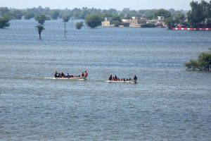 Rescue 1122 Boats carrying residents evacuates people from flooded areas after rising river water submerged villages