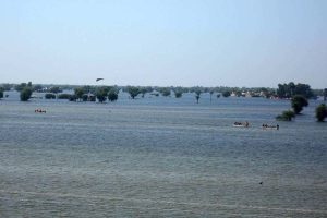 Rescue 1122 Boats carrying residents evacuates people from flooded areas after rising river water submerged villages