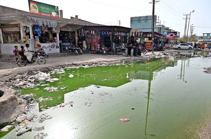 A view of stagnant sewerage water accumulated in front of New Bus Stand shops