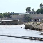 A view of the breach point at Gilani embankment as high flow of flood water posing a threat to nearby settlements