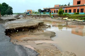 A view of a damaged road cut off from adjoining areas due to recent flooding in River Chenab near Dost Muhammad Lali Bridge, Bhowana, District Chiniot.