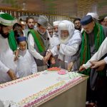 People cutting cake on the eve of Eid Milad-un-Nabi (SAWW) commemoration of the birth anniversary of Prophet Mohammed (SAAW)