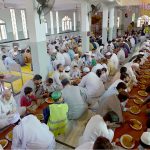 Volunteers serving langar to participants of Eid Milad-un-Nabi (SAWW) rally at the shrine of Hazrat Sheikh Junaid Baba Ji