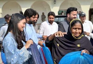 Japanese student Ms. Hikari Kiran Shah Tokunaga donating sewing machines to flood-affected families.
