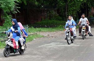 Students arriving at school on the first day after summer vacation in the provincial capital.
