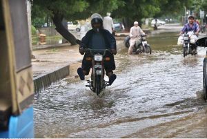 A view of Lyari River from the bridge during rainfall in the city
