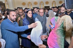 Minister of State for Development and Planning Chaudhry Armaghan Subhani addresses flood victims in the Bajwat area.