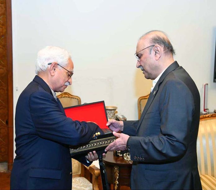 Dr. Sayed Bader Hashemi presenting his book “Allah Speaks to You in Quran” to President Asif Ali Zardari at Aiwan-e-Sadr