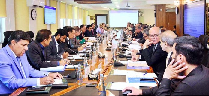 A view of Federal Minister for Finance and Revenue, Senator Muhammad Aurangzeb, chairing the Economic Coordination Committee (ECC) meeting of the Cabinet at the Finance Division