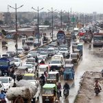 A view heavy traffic on Super High Way during rain that experienced in the city.