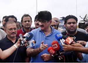 Sindh Chief Minister Syed Murad Ali Shah, accompanied by provincial ministers, inspects the Lyari River flowing at peak levels near the Machhar Colony section of the Lyari Expressway