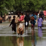 Flood victims struggle as pump prices soar, but communities share to endure