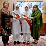 Parliamentary Secretary, Ministry of Federal Education and Professional Training, Ms. Farah Naz Akbar participating in a candle exchange between the head girls of outgoing and incoming office bearers during the Student Council Investiture Ceremony 2025-26 of Islamabad Model College for Girls I-10/4 sector