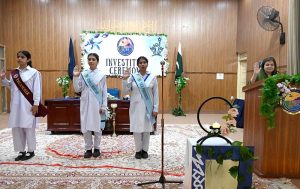 Parliamentary Secretary, Ministry of Federal Education and Professional Training, Ms. Farah Naz Akbar participating in a candle exchange between the head girls of outgoing and incoming office bearers during the Student Council Investiture Ceremony 2025-26 of Islamabad Model College for Girls I-10/4 sector