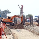 Labourers are busy construction work of T-Chowk Flyover during development work in Federal Capital.