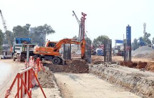 Labourers are busy construction work of T-Chowk Flyover during development work in Federal Capital.