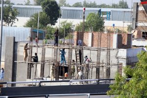 Laborers busy at work as the Capital Development Authority (CDA) constructs a bus charging station in H-8, part of a broader initiative to expand the electric bus network in the Federal Capital.
