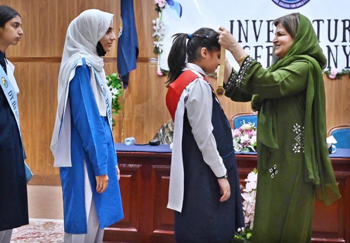 Parliamentary Secretary, Ministry of Federal Education and Professional Training, Ms. Farah Naz Akbar, confers medals to the newly elected office bearers during investiture ceremony of Student Council 2025-26 of Islamabad Model College for Girls I-10/4