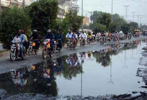Sewerage water accumulated on Millat Road causes inconvenience for drivers, highlighting the urgent need for intervention by authorities