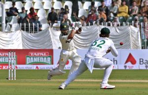 Pakistani batter Abdullah Shafique plays a shot during the first day of the second Test match between Pakistan and South Africa at the Rawalpindi Cricket Stadium.