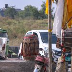 Dhol player waiting for customers at his roadside setup in the Federal Capital