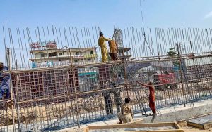 Labourers are busy construction work of T-Chowk Flyover during development work in Federal Capital.