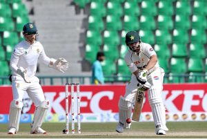 Pakistan’s batsman Salman Agha plays a shot on the second day of the first Test match between Pakistan and South Africa at the Gaddafi Stadium