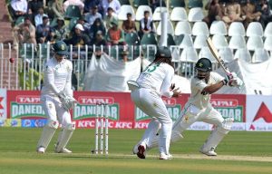 Pakistani batter Abdullah Shafique plays a shot during the first day of the second Test match between Pakistan and South Africa at the Rawalpindi Cricket Stadium.