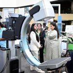 Visitors take interest in a stall during the second day of the Health Asia Exhibition at the Expo Centre