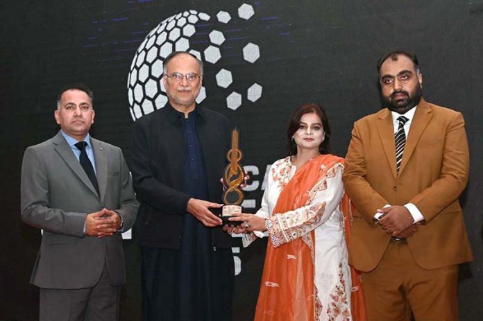 Federal Minister for Planning, Development and Special Initiatives Prof. Ahsan Iqbal distributing awards during ceremony in connection with Teachers' Day
