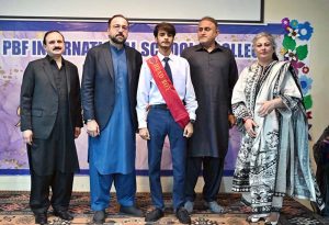 Federal Minister for Overseas Pakistanis and Human Resource Development, Chaudhry Salik Hussain being presented flower bouquet on his arrival at Investiture Ceremony of PBF International School & College H-9.