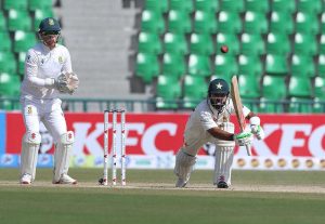 Pakistan’s batsman Salman Agha plays a shot on the second day of the first Test match between Pakistan and South Africa at the Gaddafi Stadium