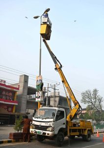 Municipal Corporation workers are repairing street lights on Circuit House Road.