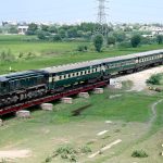 A view of the Mohenjo Daro passenger train passing through near the bypass on the way from Larkana to Kotri