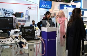 Visitors take interest in a stall during the second day of the Health Asia Exhibition at the Expo Centre