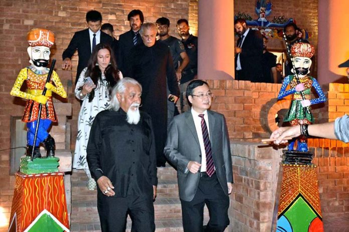 Chinese Consul General Zhao Shiren being briefed about Pakistan’s centuries-old puppetry traditions at Rafi Peer Museum last late night